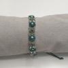 Bracelet with 7mm cabochons, Swarovski bicones, Miyuki seed beads and macrame cord.